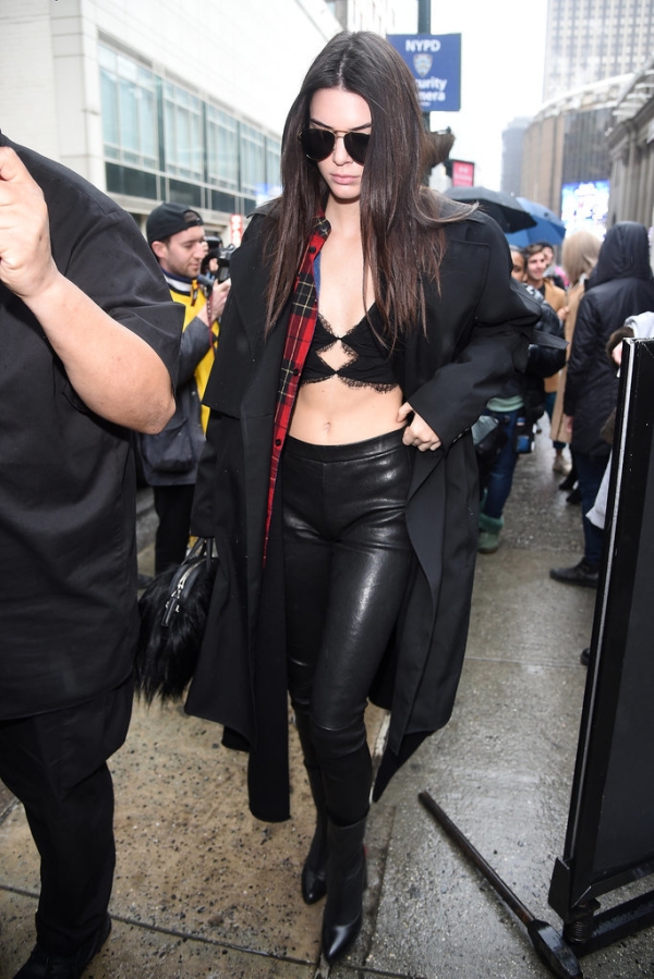 Kendall Jenner wearing a Noam Hanoch bra top and Vince leggings.  