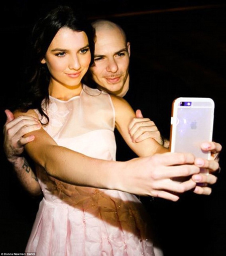 Maya, pictured above with Pitbull, wore two bespoke dresses during the evening, designed by Rolando Santana