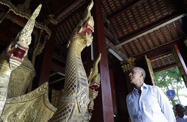 President Obama paused in the Ho Raj Rod, or Carriage House, as he toured the Wat Xieng Thong Buddhist Temple