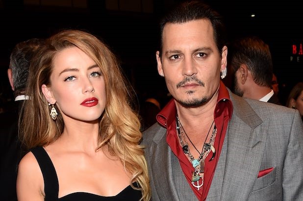 Amber Heard tiep tuc doi tien Johnny Depp sau ly hon hinh anh 1