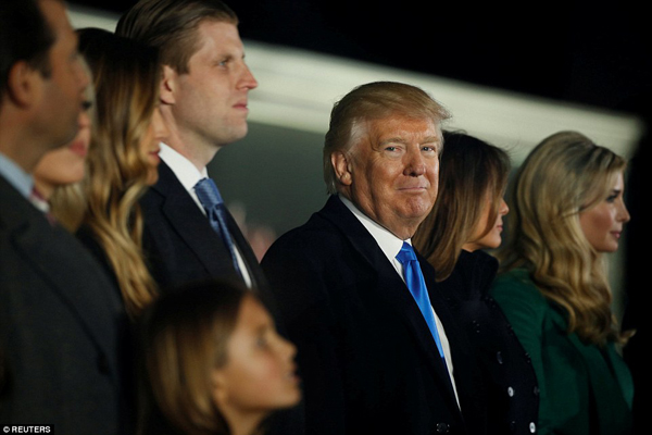 Trump smiled surrounded by his son Eric, his wife Melania and his daughter Ivanka during Thursday nights soiree