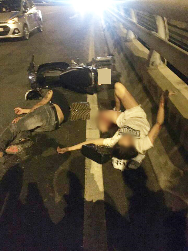 Hà Nội: Cô gái trẻ bị gãy gập chân vẫn bình thản nằm bấm điện thoại sau va chạm giao thông - Ảnh 1.