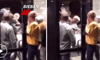 Justin Bieber ẩu đả trên vỉa hè, bị đấm và vật xuống đất