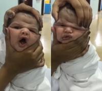 Y tá bị đuổi việc vì đùa nghịch với gương mặt em bé mới sinh